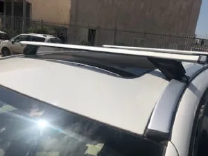 גגון אווירודינמי לרכבים בעלי מוטות אורך צמודים